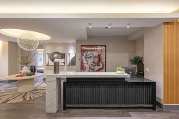 the lobby of a hotel with a reception desk